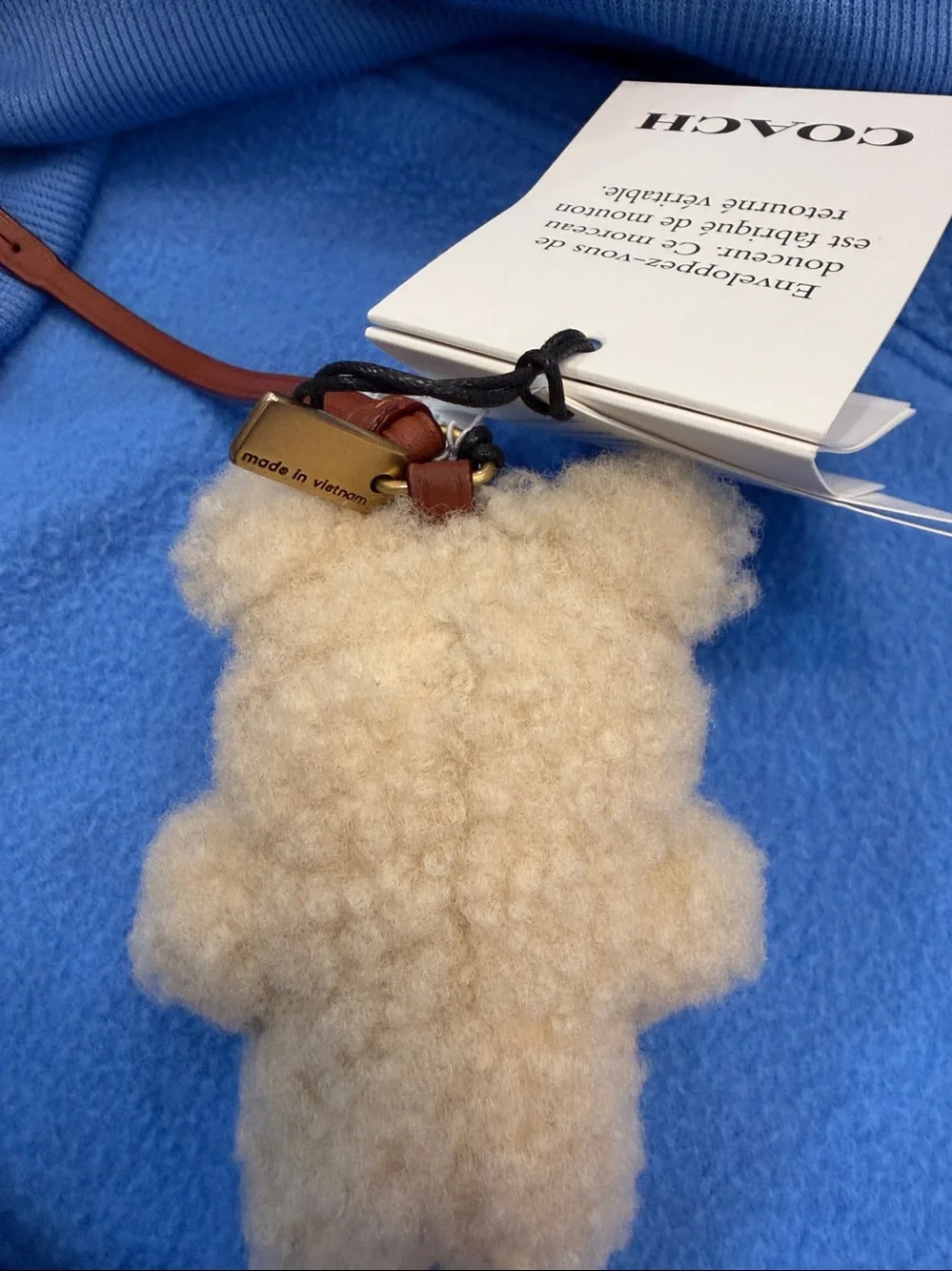 COACH Cream Shearling Bear Bag Charm with Brown Leather Strap